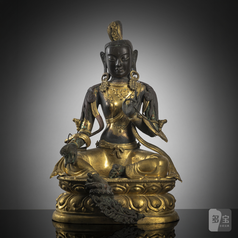 A PARCEL-GILT EMBOSSED COPPER FIGURE OF SYAMATARA